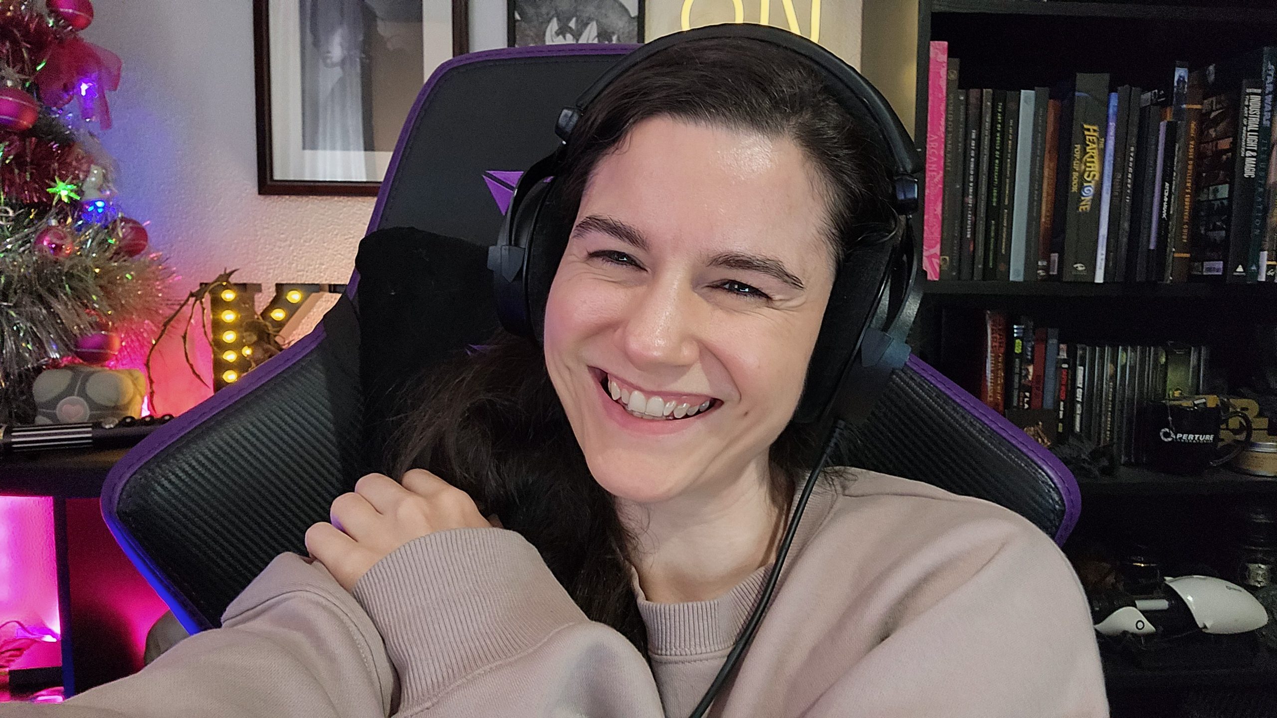 Woman with long brown hair smiles - talking voice over professional services costs in 2025 and beyond