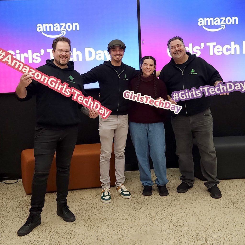 The crew of Canopy Creative Immersive Experience Tech Smile for the camera at AWS Girls Tech Day