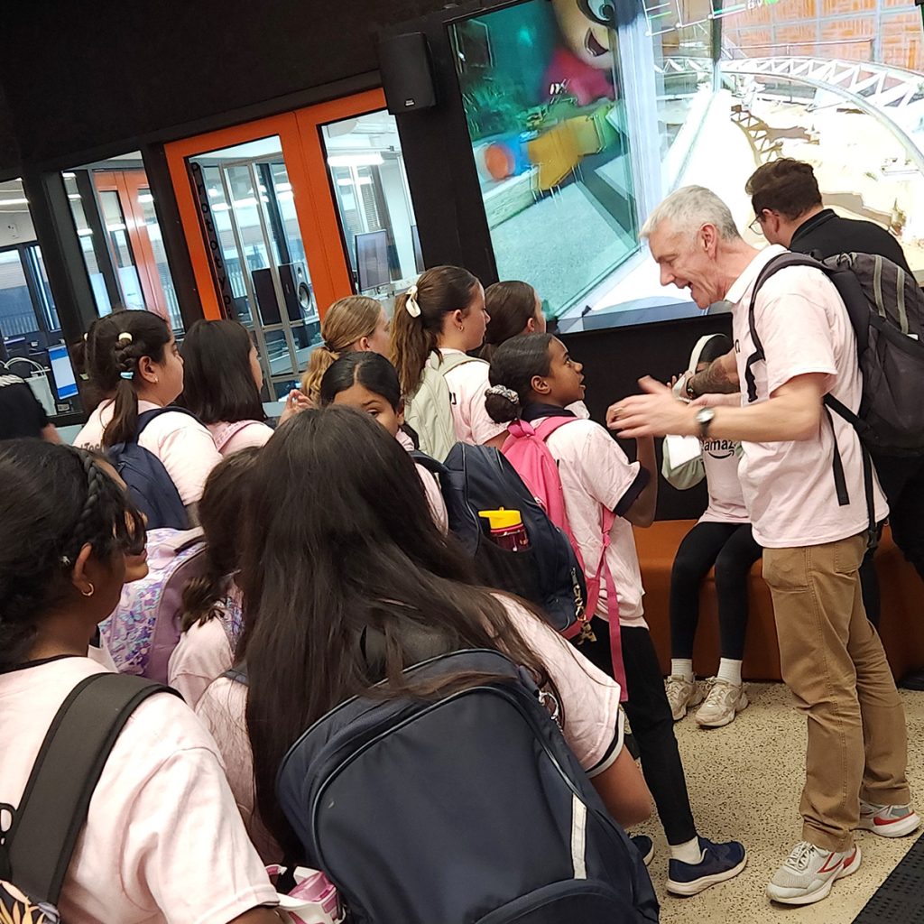 A line of girls forms to try the VR rollercoaster expeirence from Canopy Creative